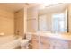 Clean bathroom with a shower/tub combo, toilet and light wood vanity at 14300 Waterside Ln # L5, Broomfield, CO 80023