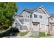 Two-story townhome with attached garage and landscaping at 14300 Waterside Ln # L5, Broomfield, CO 80023
