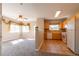 Open kitchen with light wood cabinets and tile flooring at 14300 Waterside Ln # L5, Broomfield, CO 80023