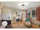 Living room with fireplace, seating area, and access to other rooms at 27425 Spruce Ln, Evergreen, CO 80439