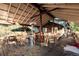 Spacious patio with multiple tables, chairs, and a heater at 27425 Spruce Ln, Evergreen, CO 80439