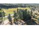 Aerial view showcasing home's location and surrounding mountain landscape at 27425 Spruce Ln, Evergreen, CO 80439