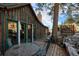 Wooden cabin exterior with a deck and mountain views at 27425 Spruce Ln, Evergreen, CO 80439