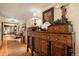 Hallway with antique furniture and view into other rooms at 27425 Spruce Ln, Evergreen, CO 80439