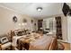 Charming bedroom featuring a wooden bed frame and rustic decor at 27425 Spruce Ln, Evergreen, CO 80439