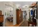 Long hallway with antique furniture and access to bedrooms and bath at 27425 Spruce Ln, Evergreen, CO 80439