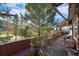 Relaxing deck overlooks scenic views and features wooden railings at 27425 Spruce Ln, Evergreen, CO 80439