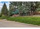 Exterior view of the home showcasing the building's architecture and landscaping at 27425 Spruce Ln, Evergreen, CO 80439