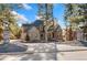 Two-story home with stone accents and a landscaped yard at 5440 Soapweed Cir, Parker, CO 80134