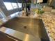 Stainless steel farmhouse sink with granite countertop at 12207 Stone Timber Ct, Parker, CO 80134