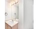 Bathroom with vanity, mirror and light fixtures at 1646 S Deframe St # A1, Lakewood, CO 80228
