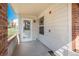 Exterior entryway to a townhouse unit, showcasing a private entrance and brickwork at 1646 S Deframe St # A1, Lakewood, CO 80228
