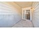 Small covered patio with sliding glass door at 1646 S Deframe St # A1, Lakewood, CO 80228