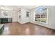 Spacious living room with hardwood floors and access to kitchen and exterior at 1646 S Deframe St # A1, Lakewood, CO 80228
