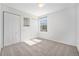Bedroom with carpet, double closets and window at 1646 S Deframe St # A1, Lakewood, CO 80228