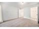 Bright bedroom with carpet flooring and access to bathroom at 1646 S Deframe St # A1, Lakewood, CO 80228