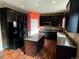 Kitchen with dark cabinetry, granite countertops, and an island at 6962 W Chatfield Dr, Littleton, CO 80128