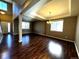 Open concept living and dining area with dark hardwood floors at 6962 W Chatfield Dr, Littleton, CO 80128