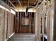 Unfinished room with exposed wooden framing and window at 2891 S Cherokee, Englewood, CO 80110