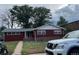 Red brick ranch home with mature trees and landscaping at 3475 S Marion St, Englewood, CO 80113