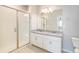 Bathroom boasts double sinks, granite countertops, and a walk-in shower at 15700 E Jamison Dr # 8-203, Englewood, CO 80112