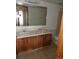 Bathroom with double sinks and toilet at 12043 W Cross Dr # 201, Littleton, CO 80127