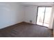 Bright bedroom with carpet and sliding glass door at 12043 W Cross Dr # 201, Littleton, CO 80127