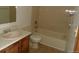Bathroom with tub, toilet, and vanity at 12043 W Cross Dr # 201, Littleton, CO 80127