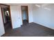 Bedroom with carpet, doors to bathroom and closet at 12043 W Cross Dr # 201, Littleton, CO 80127