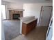 Kitchen with breakfast bar and access to living room at 12043 W Cross Dr # 201, Littleton, CO 80127