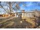 Home's back exterior and expansive grassy yard at 1151 S Nome St, Aurora, CO 80012