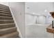 Basement stairs leading to a spacious finished basement at 1151 S Nome St, Aurora, CO 80012