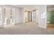 Spacious bedroom with mirrored closet doors and access to a bathroom at 1151 S Nome St, Aurora, CO 80012