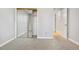 Bedroom with mirrored closet and neutral decor at 1151 S Nome St, Aurora, CO 80012