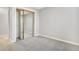 Bright bedroom with mirrored closet doors and plush carpeting at 1151 S Nome St, Aurora, CO 80012