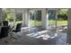 Bright dining area with glass table and sliding doors to backyard at 1151 S Nome St, Aurora, CO 80012