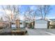 House exterior showcasing a ranch style home with mature trees and landscaping at 1151 S Nome St, Aurora, CO 80012