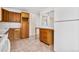Kitchen with oak cabinets, tile flooring and a breakfast bar at 1151 S Nome St, Aurora, CO 80012