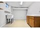 Basement laundry room with utility sink and cabinets at 1151 S Nome St, Aurora, CO 80012