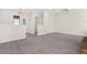 Open living room with gray carpeting, high ceiling and view of entryway at 1151 S Nome St, Aurora, CO 80012