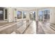 Sunroom with tile floors and multiple windows offering natural light at 1151 S Nome St, Aurora, CO 80012