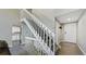 Interior view of a staircase leading to the upper level with a kitchen view at 2904 S Scranton St, Aurora, CO 80014