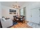 Bright dining area with hardwood floors and seating for six at 18872 E Prentice Pl, Centennial, CO 80015