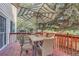 Deck with patio table and chairs, shaded by umbrella at 18872 E Prentice Pl, Centennial, CO 80015