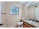 Clean bathroom with granite vanity and updated fixtures at 18872 E Prentice Pl, Centennial, CO 80015