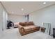 Finished basement with sofa, bed, and large mirror at 18872 E Prentice Pl, Centennial, CO 80015