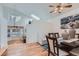 Open concept dining room with hardwood floors and vaulted ceilings at 18872 E Prentice Pl, Centennial, CO 80015