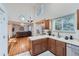 Kitchen boasts stainless steel appliances and hardwood floors at 18872 E Prentice Pl, Centennial, CO 80015
