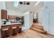 Kitchen with island, stainless steel appliances, and hardwood floors at 18872 E Prentice Pl, Centennial, CO 80015