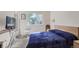 Bright bedroom with a double bed, window, and TV at 18872 E Prentice Pl, Centennial, CO 80015